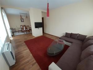 a living room with a couch and a table at Statevi Guest Apartment in Velingrad