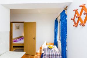 Ein Bett oder Betten in einem Zimmer der Unterkunft Apartments & Rooms Mihajica