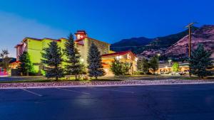 a street in a town with mountains in the background at Best Western Plus Canyon Pines in Ogden