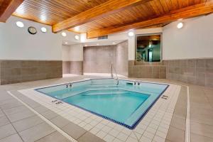 a large swimming pool in the middle of a room at Ramada by Wyndham Kamloops in Kamloops