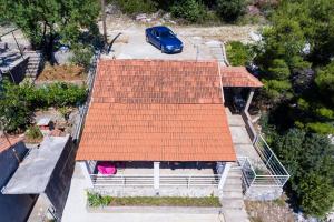 an overhead view of a house with an orange roof at Holiday Home Magazin in Slano