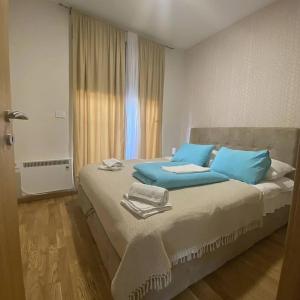 Postel nebo postele na pokoji v ubytování Apartman Prezident In