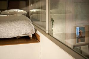 Кровать или кровати в номере Lo Studio di Battista
