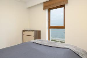 Postel nebo postele na pokoji v ubytování Apartament nad morzem Słońce i Plaża + 69 fotografií