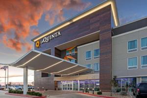 a rendering of a building with a hotel at La Quinta by Wyndham Lubbock South in Lubbock