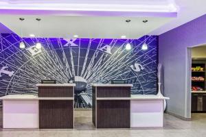 a salon with purple walls and purple counters at La Quinta by Wyndham Lubbock South in Lubbock +37 photos