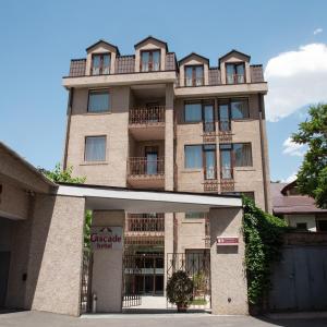 a large brick building with balconies on it at Cascade Hotel in Yerevan