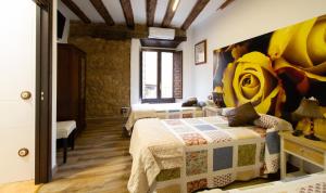 Postel nebo postele na pokoji v ubytování La Pata de Oca Hostal Rural y Albergue