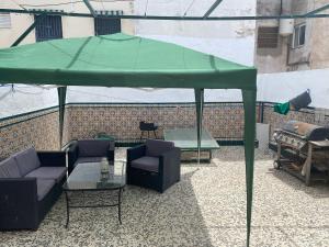A seating area at CASA REFORMADA CON TERRAZA/WIFI/AIRE ACONDICIONADO