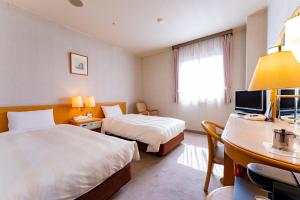 TV a/nebo společenská místnost v ubytování Oyama Palace Hotel