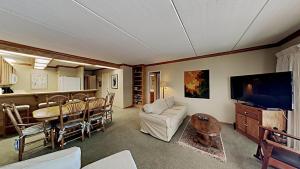 a living room with a couch and a table at Lakeview 826 Condo #108 Condo in Mammoth Lakes