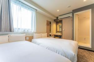 Letto o letti in una camera di CVS Bay Hotel
