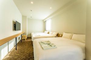 Letto o letti in una camera di CVS Bay Hotel