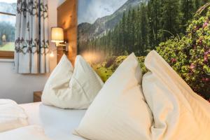 Postel nebo postele na pokoji v ubytování Landhotel Hinteraigengut