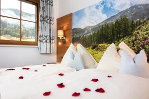 Postel nebo postele na pokoji v ubytování Landhotel Hinteraigengut
