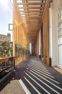 a hallway of a building with a wooden walkway at Dominic Smart & Luxury Suites - Terazije in Belgrade