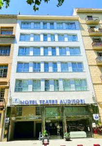 a building with a sign that reads hotel league alpha at SM Hotel Teatre Auditori in Barcelona