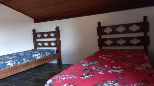 Ένα ή περισσότερα κρεβάτια σε δωμάτιο στο Ubatuba Surf Hostel, apenas a 60 metros da praia da Lagoinha!