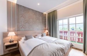 Llit o llits en una habitació de Lust und Laune Hotel am Wörthersee