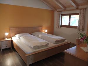 Postel nebo postele na pokoji v ubytování Haus Schlernblick