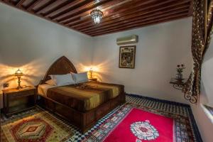 Postel nebo postele na pokoji v ubytování Riad Pacha Palace