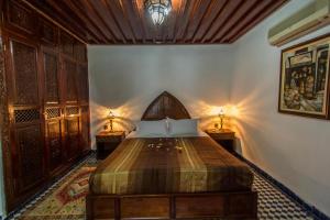 Postel nebo postele na pokoji v ubytování Riad Pacha Palace