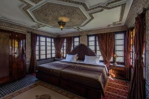 Postel nebo postele na pokoji v ubytování Riad Pacha Palace