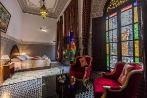 Postel nebo postele na pokoji v ubytování Riad Pacha Palace