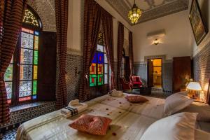 Postel nebo postele na pokoji v ubytování Riad Pacha Palace