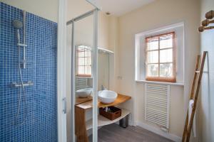 a bathroom with a sink and a shower at Kereden Location in Saint Malo +38 photos