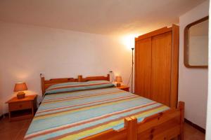 Ліжко або ліжка в номері Holiday home in Torre delle Stelle 22927