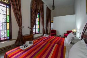 Postel nebo postele na pokoji v ubytování Riad Pacha Palace