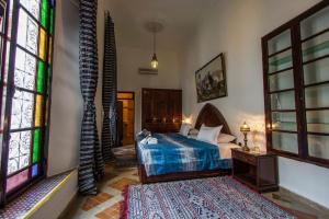 Postel nebo postele na pokoji v ubytování Riad Pacha Palace