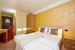 Voodi või voodid majutusasutuse Negritella Sweet Hotel toas