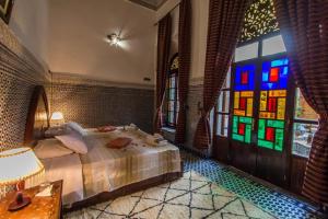 Postel nebo postele na pokoji v ubytování Riad Pacha Palace