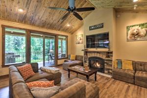 a living room with a couch and a fireplace at Bigfork Modern Living - Pet and Family Friendly! in Bigfork