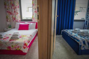 Postel nebo postele na pokoji v ubytování Lemmas Apartament Anchoria