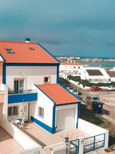 a view of a house with an orange roof at Be Baleal Surfhouse in Baleal +18 photos