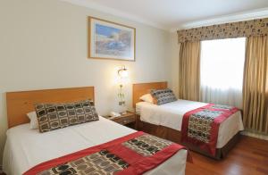 Кровать или кровати в номере Hotel Plaza Concepción