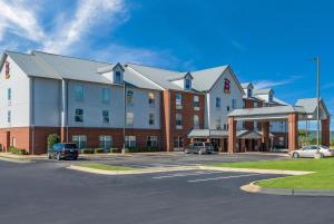 a rendering of a hotel with a parking lot at Red Roof Inn PLUS & Suites Birmingham - Bessemer in Bessemer