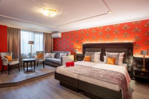 Cama ou camas em um quarto em Villa Westend Hotel an der Messe