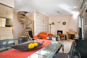 a living room with a glass table with fruit on it at Villa Inspiration in Fiskardho