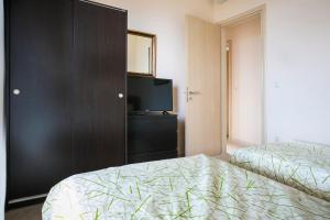 A bed or beds in a room at Villa Inspiration Még 12 kép