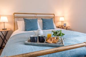 a tray of food on top of a bed at North Cottage Alderton Air Manage Suffolk in Woodbridge