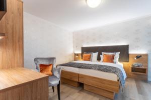 Cama ou camas em um quarto em Villa Westend Hotel an der Messe