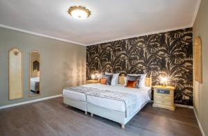 Cama ou camas em um quarto em Villa Westend Hotel an der Messe