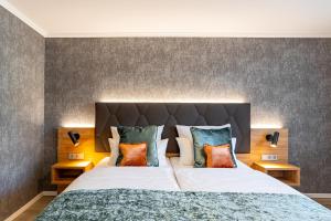 Cama ou camas em um quarto em Villa Westend Hotel an der Messe