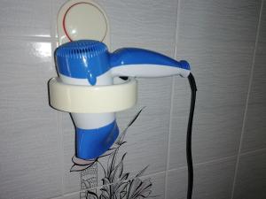 a blue and white toilet in the corner of a bathroom at B&b Cilento Paestum in Paestum