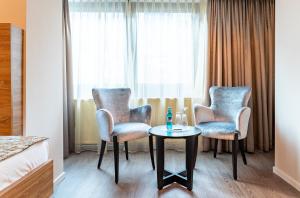 Uma área de estar em Villa Westend Hotel an der Messe