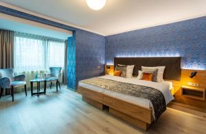 Cama ou camas em um quarto em Villa Westend Hotel an der Messe
